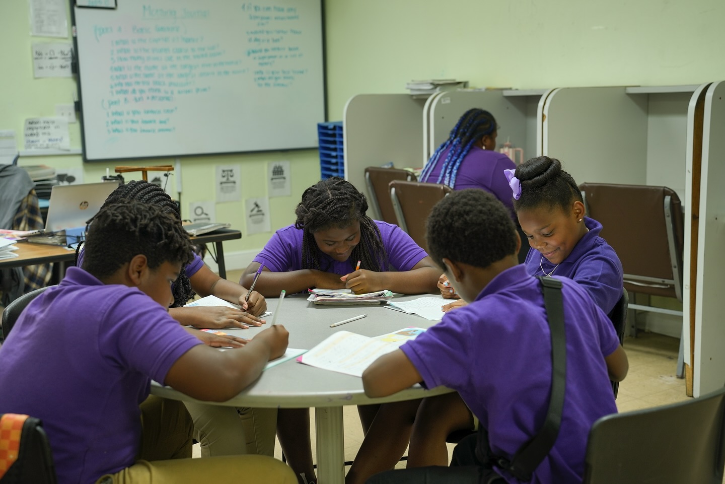 Students with their teacher at Kiily's Kids Academy