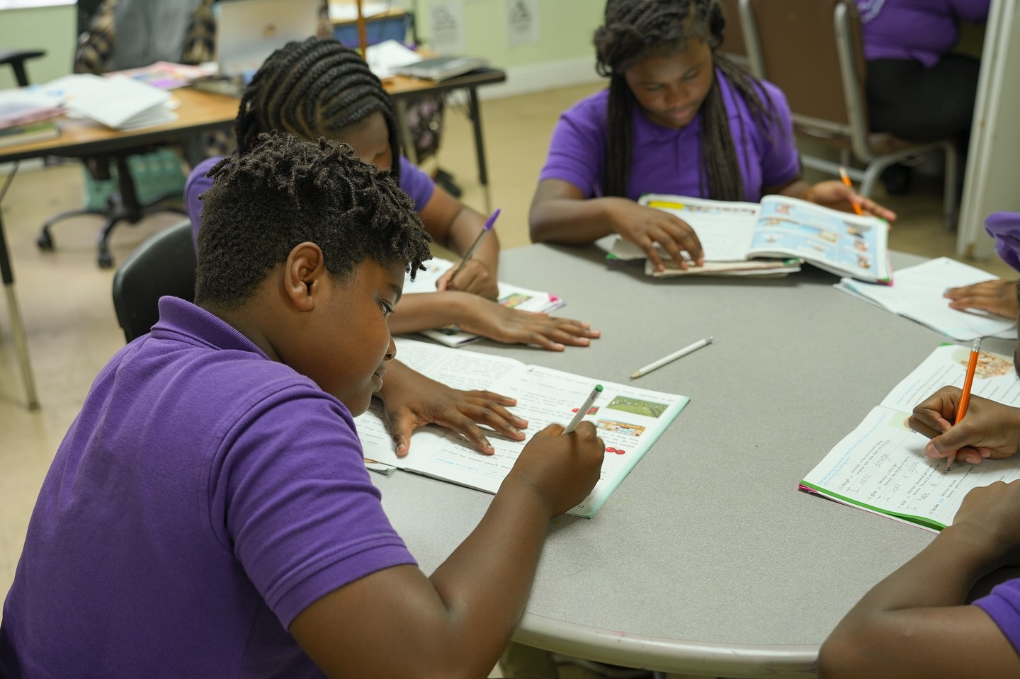 Students focused on their writing lesson